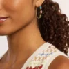Boucles d&rsquo;oreilles créoles en acier inoxydable doré de la collection Good Luck