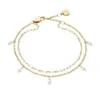 Bracelet Ellis Shaky Glitz en acier inoxydable doré à plusieurs rangs Bracelet Ellis Shaky Glitz en acier inoxydable doré à plusieurs rangs